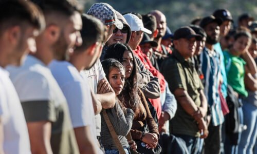 Immigrant wait in line