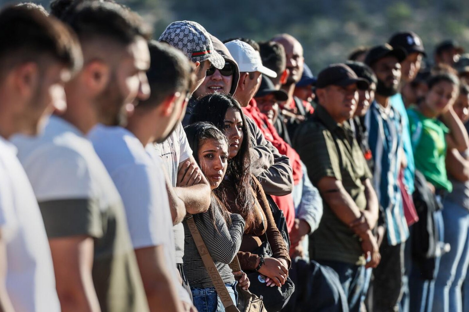 Immigrant wait in line